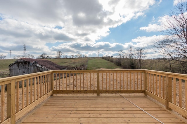 wooden terrace featuring a rural view