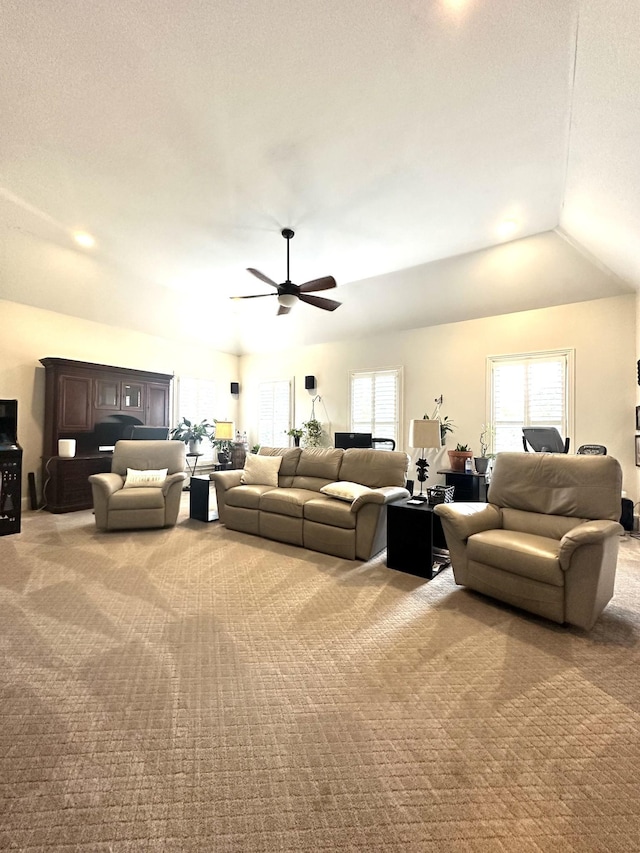 living room featuring light carpet, ceiling fan, and lofted ceiling