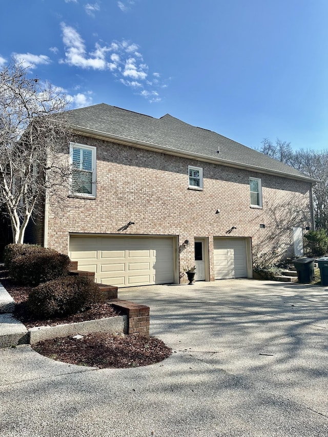 view of side of property with a garage