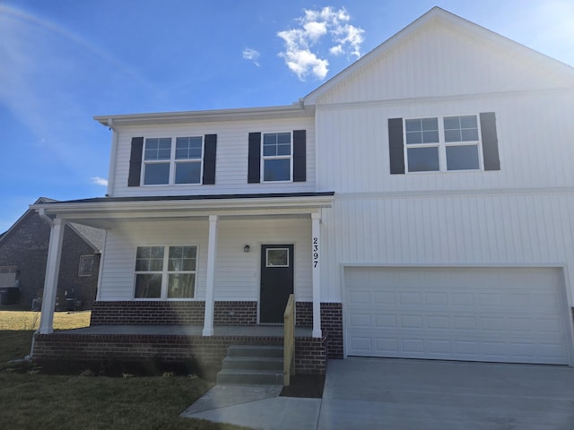 view of front of house with a porch and a garage