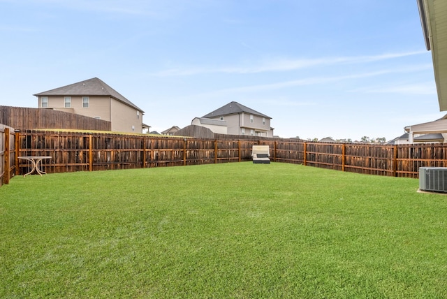 view of yard featuring central AC