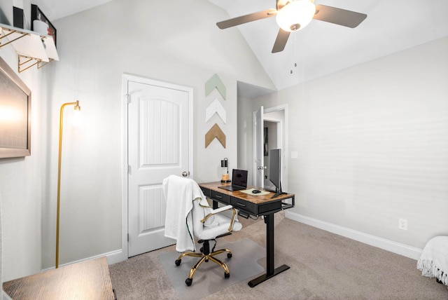 carpeted office space featuring ceiling fan and vaulted ceiling