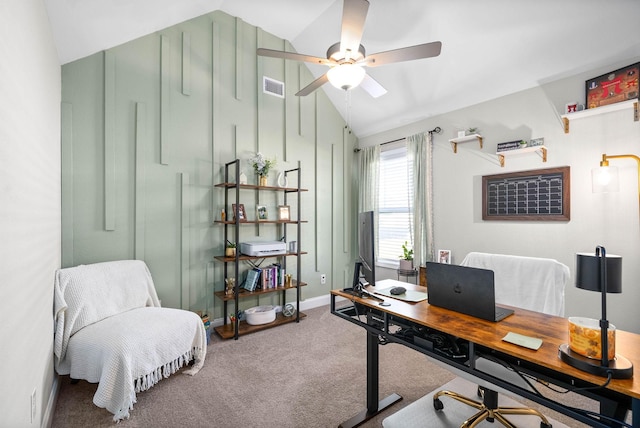 carpeted home office featuring ceiling fan and lofted ceiling