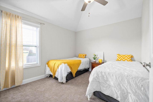 carpeted bedroom featuring vaulted ceiling and ceiling fan