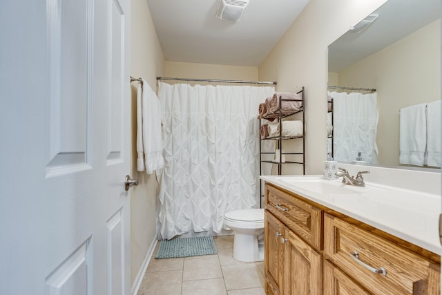 bathroom with tile patterned floors, vanity, and toilet