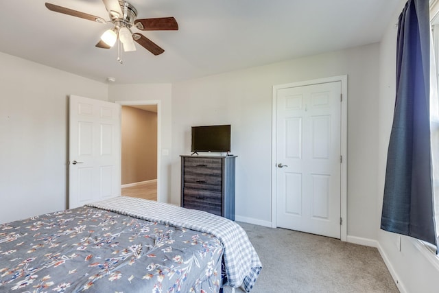 bedroom featuring ceiling fan and light carpet