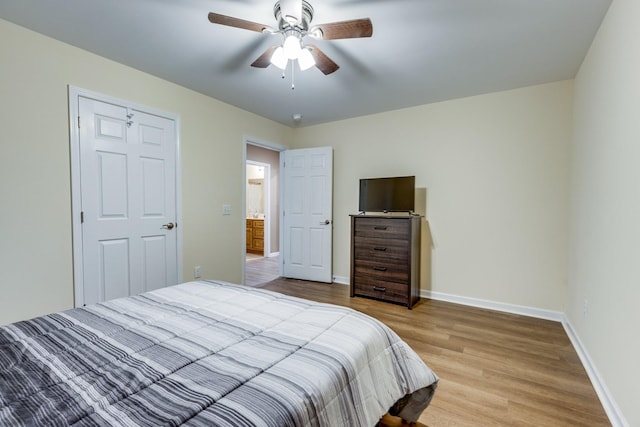 bedroom featuring a closet, ceiling fan, and light hardwood / wood-style flooring