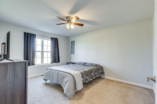 bedroom with light carpet, electric panel, and ceiling fan