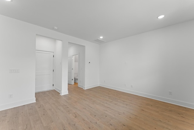 spare room featuring light hardwood / wood-style flooring