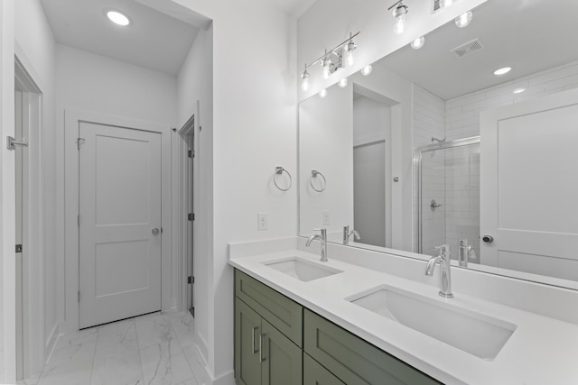 bathroom with walk in shower and vanity