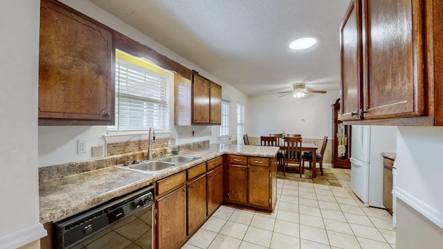 kitchen featuring ceiling fan, sink, black dishwasher, kitchen peninsula, and light tile patterned flooring