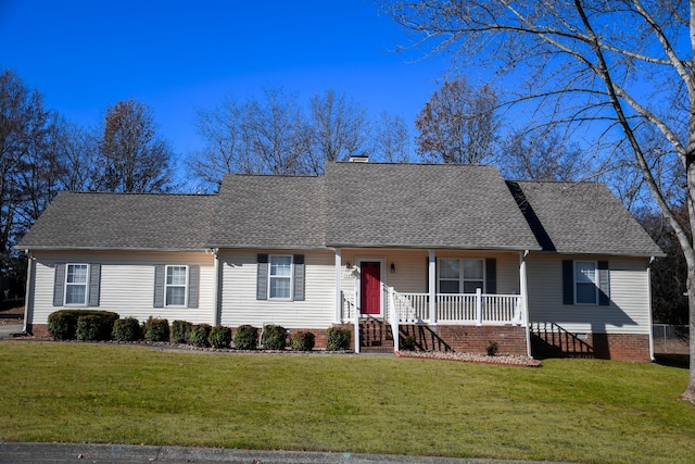 ranch-style home featuring a front yard and covered porch