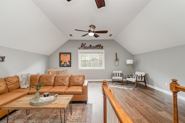 living room with hardwood / wood-style floors, ceiling fan, and lofted ceiling