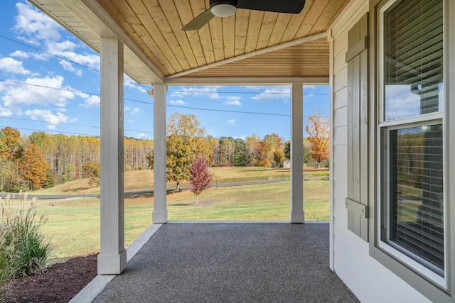 unfurnished sunroom with ceiling fan, wooden ceiling, and lofted ceiling