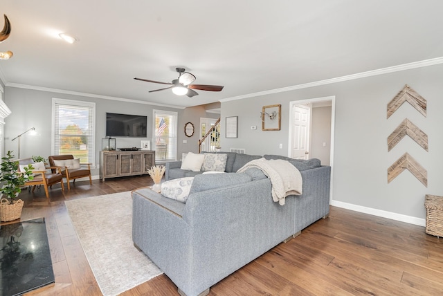 living room with ceiling fan, ornamental molding, and hardwood / wood-style flooring