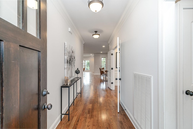 hall featuring crown molding and dark wood-type flooring