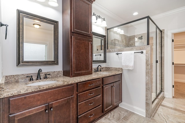 bathroom featuring vanity, an enclosed shower, and crown molding