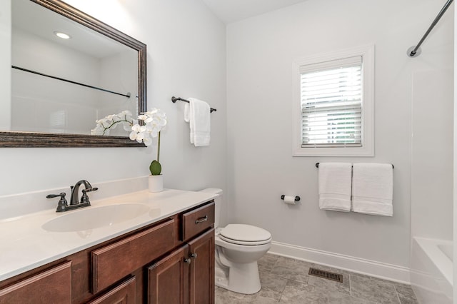 full bathroom featuring vanity, bathtub / shower combination, and toilet