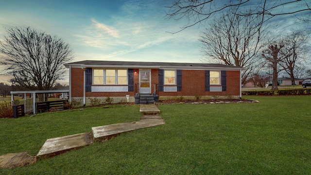 ranch-style home with a front yard