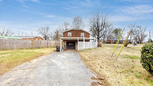 view of outbuilding featuring a carport and a yard