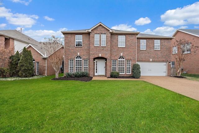 view of front of property featuring a garage and a front yard