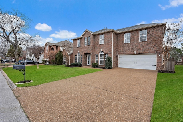 view of front of home with a garage and a front lawn