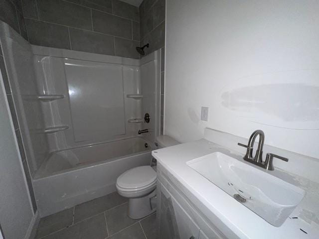 bathroom with toilet, tile patterned flooring, a sink, and shower / bathtub combination