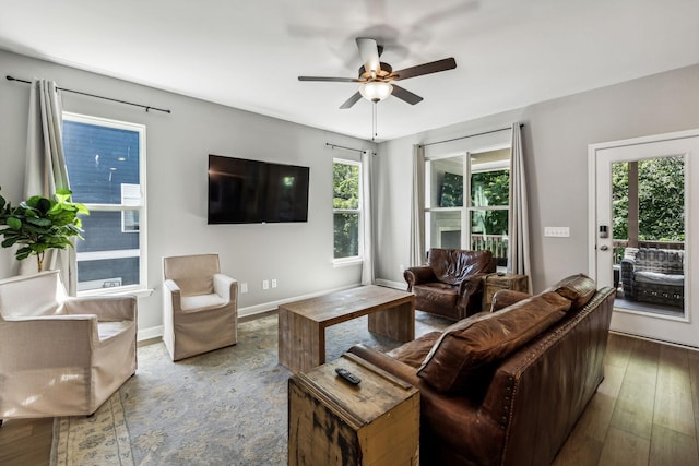 living room featuring hardwood / wood-style flooring, ceiling fan, and a healthy amount of sunlight