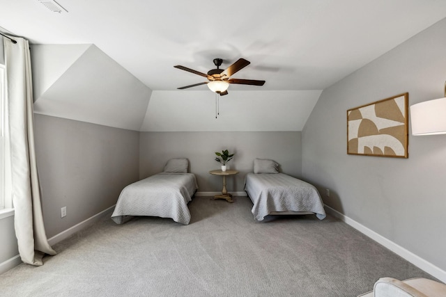 bedroom featuring light colored carpet, vaulted ceiling, and ceiling fan