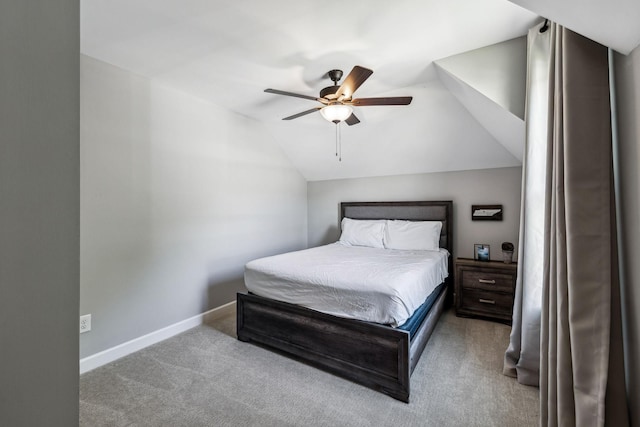 carpeted bedroom with ceiling fan and lofted ceiling