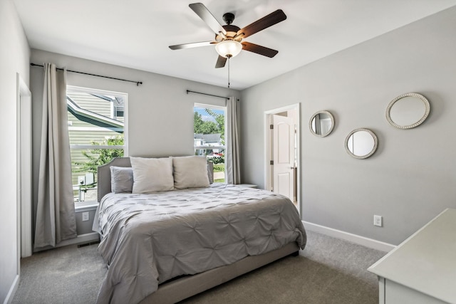 bedroom with ceiling fan and light carpet