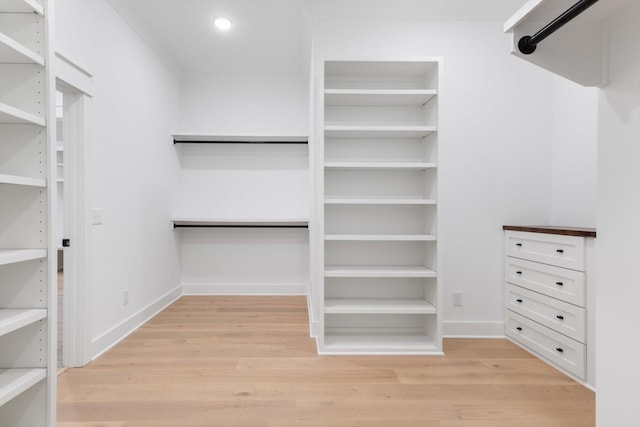 walk in closet featuring light hardwood / wood-style floors