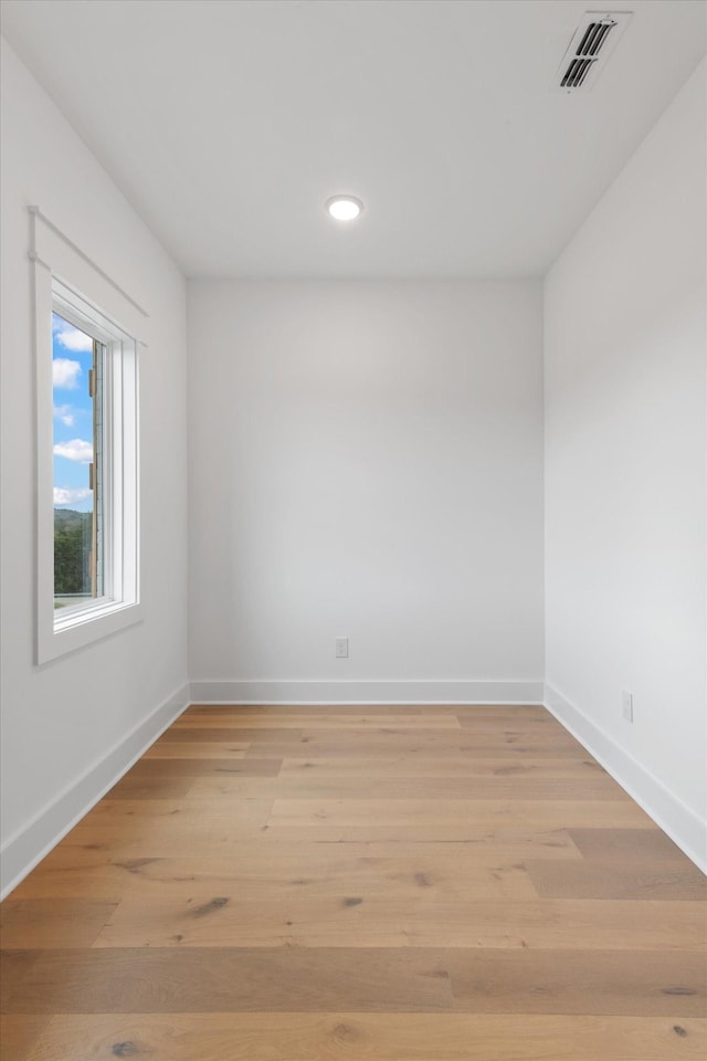 unfurnished room with light hardwood / wood-style floors