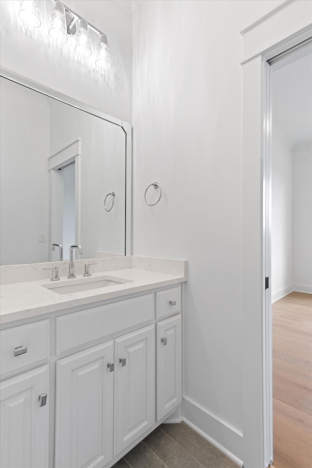 bathroom featuring hardwood / wood-style floors and vanity