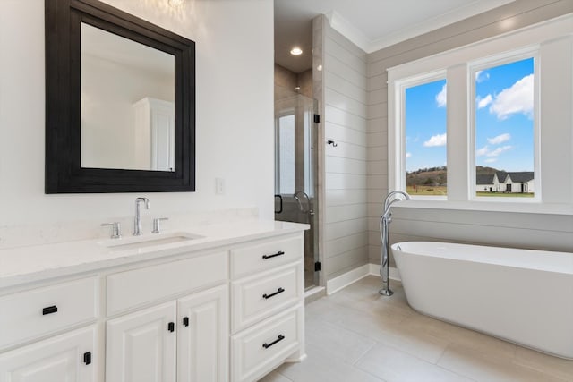 bathroom featuring tile patterned floors, vanity, and shower with separate bathtub