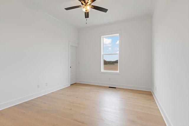 unfurnished room featuring light wood-type flooring and ceiling fan