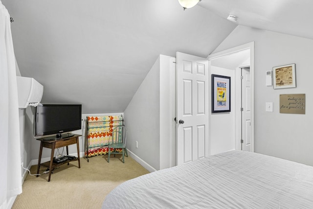 bedroom with light carpet and lofted ceiling