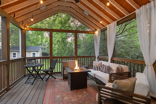 sunroom featuring vaulted ceiling