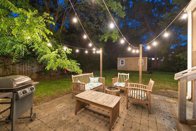 patio at twilight with a lawn and a shed