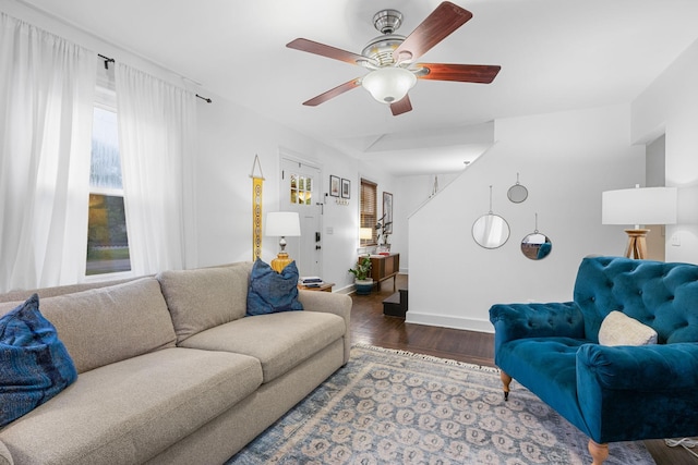 living room with ceiling fan and hardwood / wood-style flooring