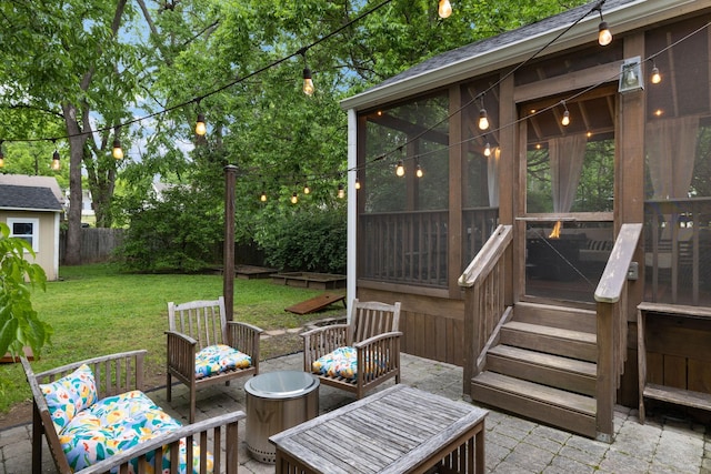 view of patio / terrace featuring a sunroom