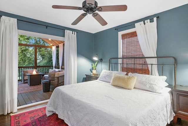 bedroom with ceiling fan and dark wood-type flooring