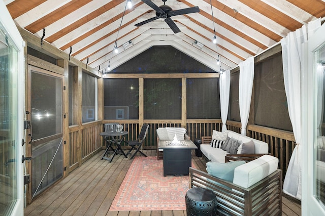 wooden deck featuring an outdoor living space with a fire pit