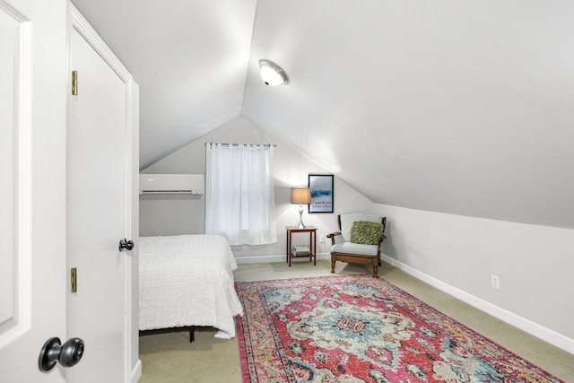 carpeted bedroom featuring vaulted ceiling and a wall mounted air conditioner