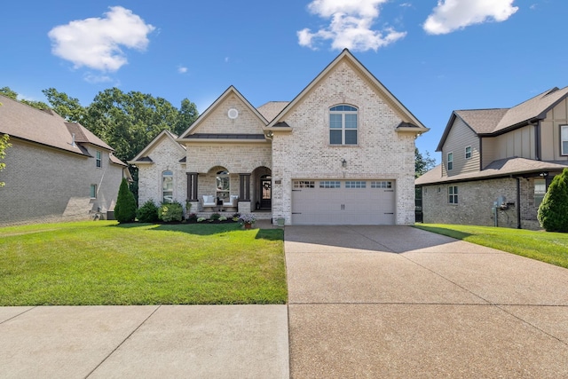 french country style house with a garage and a front yard