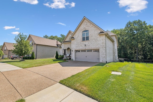 view of front of house featuring a front yard and a garage