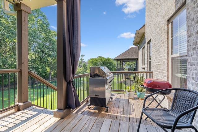 wooden deck with grilling area