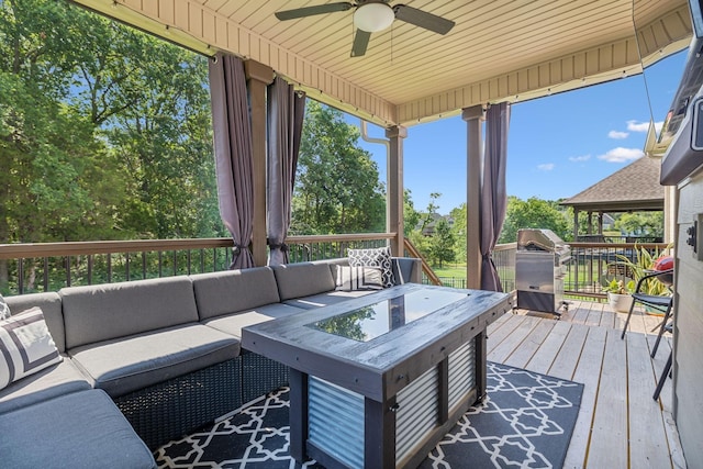 deck featuring an outdoor hangout area and ceiling fan