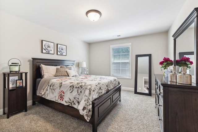 bedroom with light colored carpet