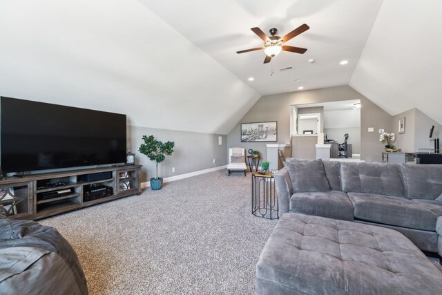 living room featuring ceiling fan, carpet floors, and vaulted ceiling